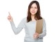 Young woman hold with clipboard and finger point up