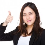 Asian businesswoman with thumb up